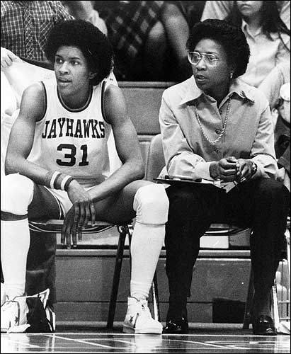 Lynette Woodard sitting courtside with Coach Washington